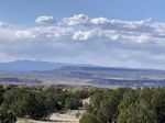 A view from the Sandia Mountains looking down at the wide open valley below