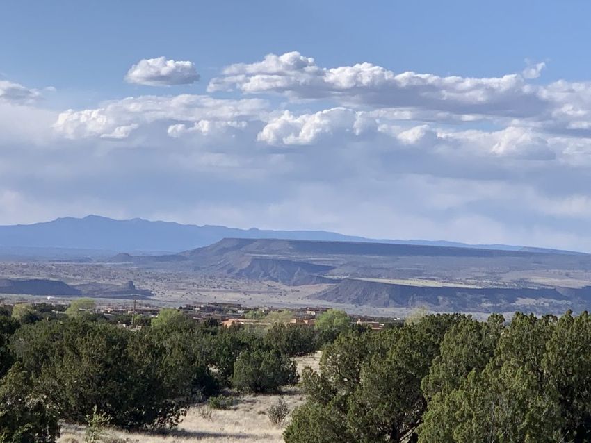 A view from the Sandia Mountains looking down at the wide open valley below