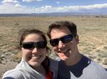 Brent and Tayler taking a selfie with the wide open prairie near the Mormon Battalion Monument in the background