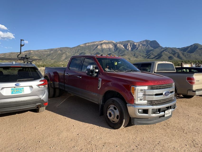 Our truck in the parking lot with the Sandia Mountains in the background
